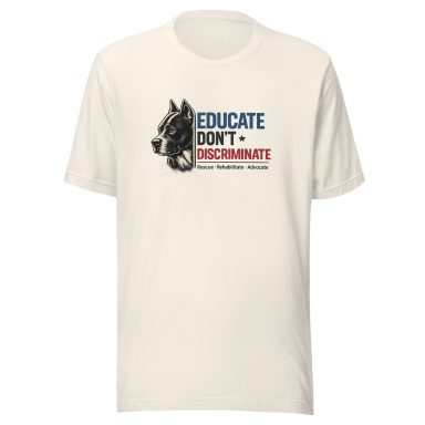 Beige t-shirt with the text "Educate Don't Discriminate" and a graphic of a wolf's head.