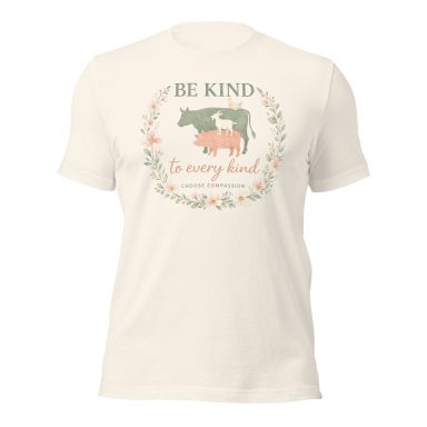 Cream-colored t-shirt featuring cows and the text "Be Kind to Every Kind."